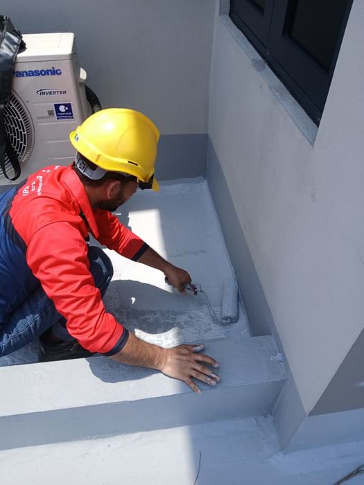 Victra worker screeding a concrete rooftop floor